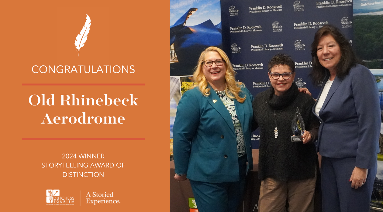 Tara Grieb of the Old Rhinebeck Aerodrome holds her award at the 2024 Awards of Distinction Breakfast alongside Dutchess Tourism CEO Melaine Rottkamp and Dutchess County Executive Sue Serino